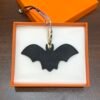 187 Factory Bag Charm Images Bat Charm Noir Epsom / Togo Violet