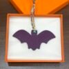 187 Factory Bag Charm Images Bat Charm Noir Epsom / Togo Violet