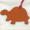 UK London 187 Factory Turtle Charms Rouge Casaque Epsom Leather / Orange Togo Leather
