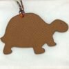 Hong Kong 187 Factory Gold Epsom Leather / Blue Azteque Togo Leather Turtle Charms