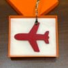 UK London 187 Factory Plane Charm Togo Noir / Epsom Rouge Casaque