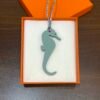 187 Factory Blue Atoll Epsom Leather / Dark Coffee Togo Leather Seahorse Charm