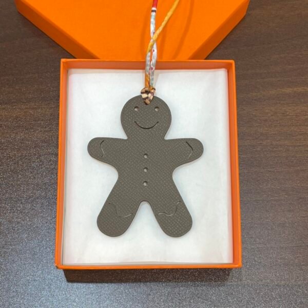 Bag Charm Images Etoupe Epsom / Orange Togo Gingerbread Man Charm