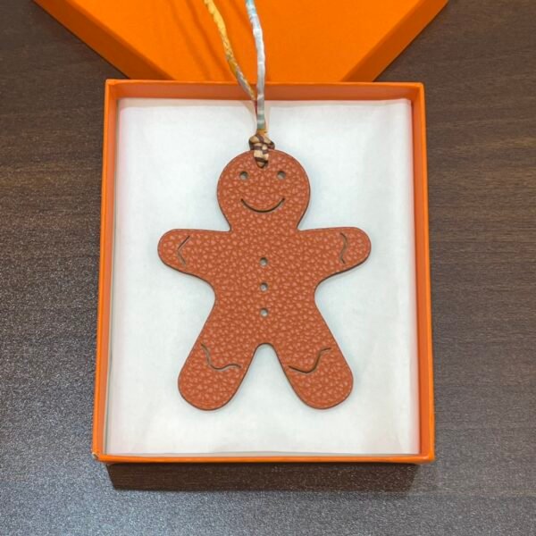 Bag Charm Images Etoupe Epsom / Orange Togo Gingerbread Man Charm