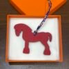 Bag Charm Images Gold Togo Leather / Rouge Casaque Epsom Military Horse Charm