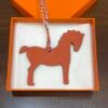 Australia Sydney Orange Togo Leather / Blue Atoll Epsom Leather Pony Charm