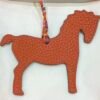 Australia Sydney Orange Togo Leather / Blue Atoll Epsom Leather Pony Charm