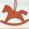 187 Factory Bag Charm Images Trojan Horse Charm Epsom Leather Rouge Casaque / Togo Leather Orange