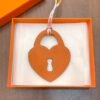 187 Factory Bag Charm Etoupe Epsom Leather / Orange Togo Leather Love Lock Charm