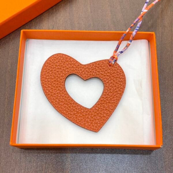 UK London 187 Factory Orange Togo Leather / Rouge Casaque Epsom Hollow Heart Charm