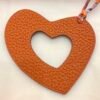 UK London 187 Factory Orange Togo Leather / Rouge Casaque Epsom Hollow Heart Charm