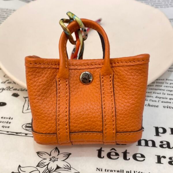 USA New York 187 Factory Orange Togo Leather Garden Party Charm Silver Hardware