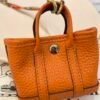 USA New York 187 Factory Orange Togo Leather Garden Party Charm Silver Hardware