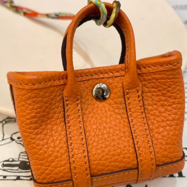 USA New York 187 Factory Orange Togo Leather Garden Party Charm Silver Hardware