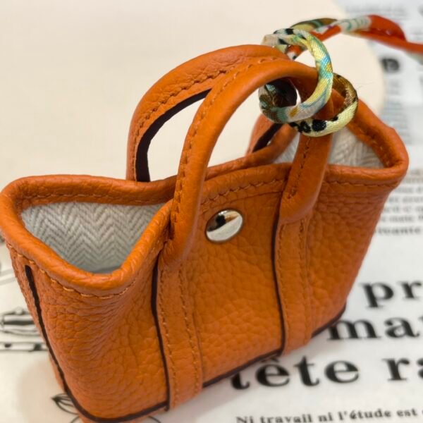USA New York 187 Factory Orange Togo Leather Garden Party Charm Silver Hardware